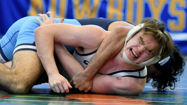 Noah Perez from Somerset picks up a pin win against Torynn Johns from Suwannee during a 175-pound on Saturday at the FHSAA Duals wrestling state championships at Osceola High School.